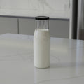 200 ML Milk Glass Bottle with Black, Gold & RX Cap